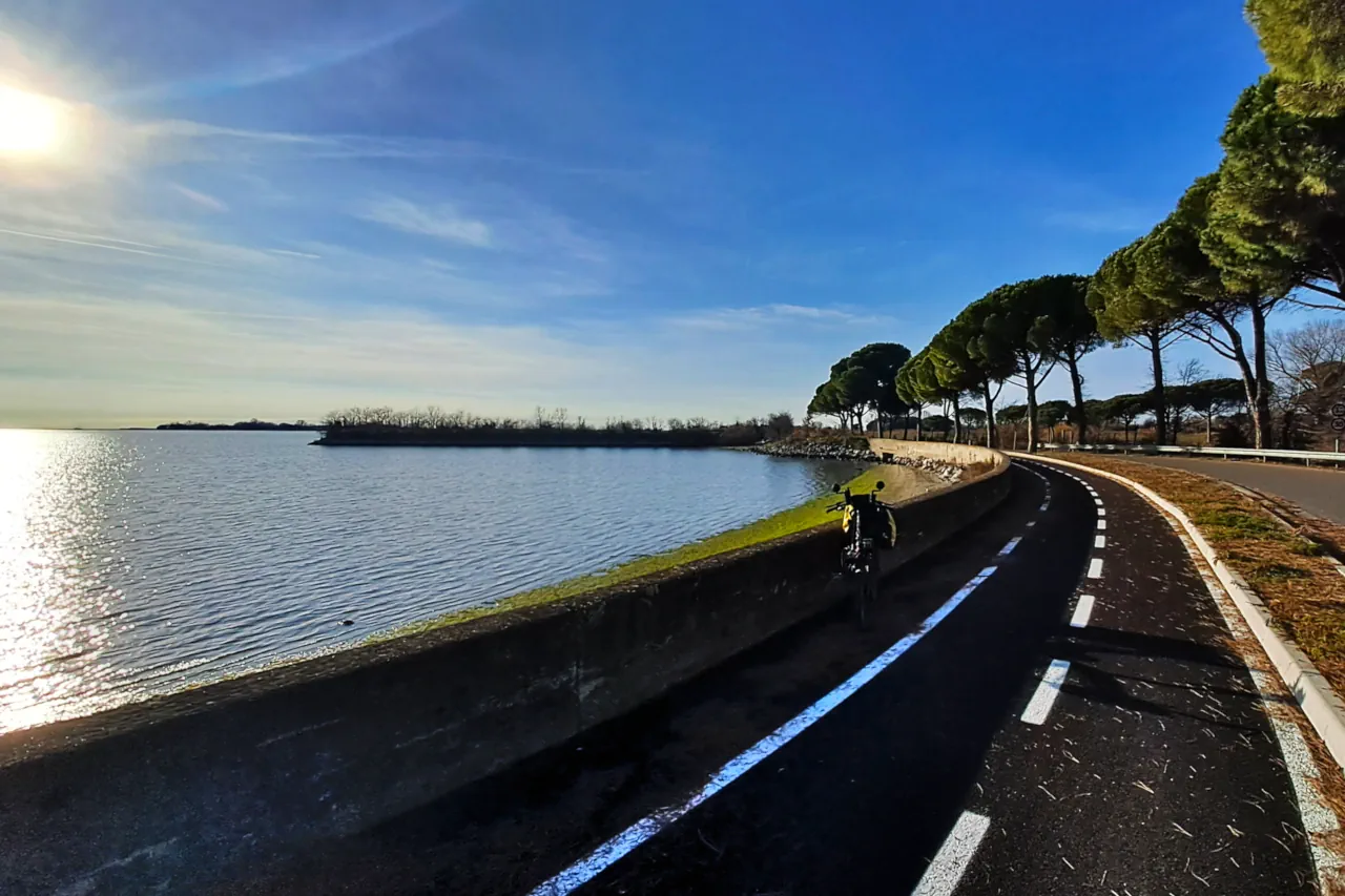 The cycle path runs alongside the Grado Lagoon